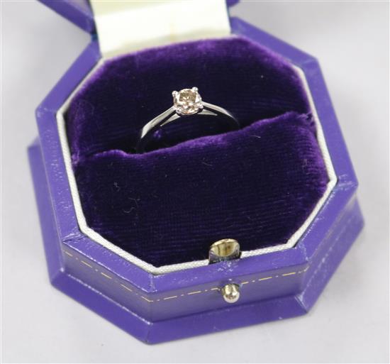 A platinum and natural fancy dark brown 0.48ct solitaire diamond ring with GIA certificate dated 15/6/18, size J.